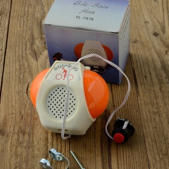 Sirene elektrisch "DOO-DOO Horn", creme-orange, das Kult-Horn der 70er !, incl. Schelle für Lenkerklemmung, rare orig. alte Neuware ! 